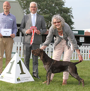 Ms L S Trow Winterwell Inca Trail with puppy group judge Mr C Bexon & Mr K Cadmore (Dorwest Herbs)