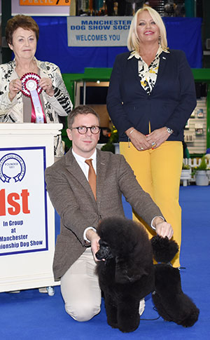 Mr T Isherwood & Mr J Lynn Ch Divining Rod's Happy Ever Afterglow (Fin Imp) with group judge Mrs J Peak & award presented by Mrs M Harding 