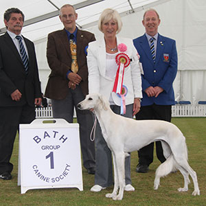 Mrs G Garratt & Miss S Oakey & Mrs K Smith Caryna Neferti with puppy group judge Mr B W Reynolds-Frost, Mr B Ford (Secretary) & Mr C Pascoe 