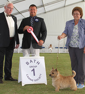 Mrs L A Crawley Ragus Mr O O'Seven with puppy group judge Mr P Harding & Mr W Browne-Cole (Chairman) 