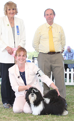 Miss H L Howard Tameron Miss Black Opium with puppy group judge Mrs V Phillips & Mr L Hunt (Committee)