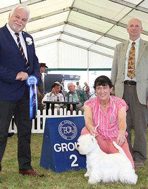 Miss M Burn & Mrs A Burns Ch Burneze Our Marni with group judge mr M P Phillips & Mr P Sheppard (Health & Safety Officer)