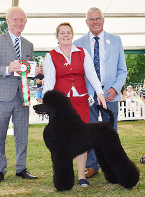 Mrs K Chu Enthony Kobwitler (Imp) with spbeg group judge Mr T Johnston & Mr L Hunt (Committee) 