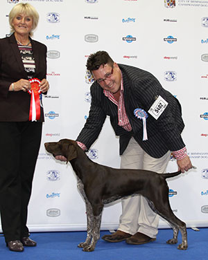 Mr G R Haran & Mrs M M Waddell Magregor Shneeball with puppy group judge Mrs P Hollings