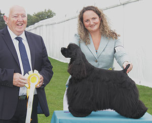 Mrs A & Mr J Manser Am Ch Silverhall Flyin High To Flipside with group judge Mr M Armstrong