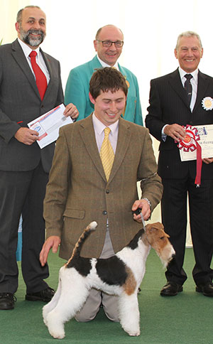 Mr V Malzoni Am Ch Hampton Court's Machida with group judge Mr D Winsley, Mr S Plane (Assistant Secretary) & Mr A Bongiovanni (Royal Canin) 