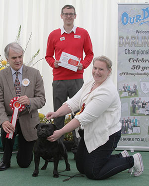 Miss M Corcoran Ch & Ir Ch & Int Ch Zakstaff Whats The Story At Mo with veteran group judge Mr G Dymock & Mr J Wolstenholme (Royal Canin)