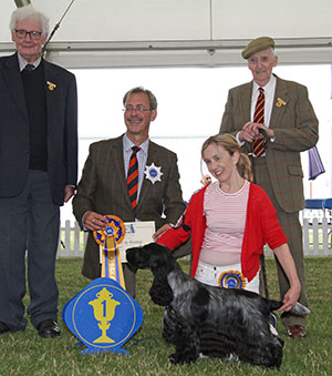 Miss S Amos-Jones Sh Ch Veratey Vincenzo At Cassom JW with group judge Mr M Gadsby, Mr E Gill (Committee) & Mr D Wade (Committee)