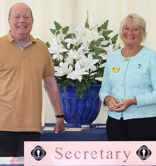 Secretary Liz Stannard with Terry Burgess, the provider of the beautiful Leeds flowers. Nice pink blingy secretary sign was a new addition this year! 