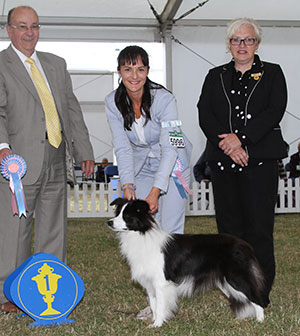 Dr M Shahmatova Nashdom La Vie Est Belle with puppy group judge Mr K Nathan & Mrs L Brown (Committee) 