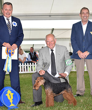 Mr P Davies Perrisblu The Butler with puppy group judge Mr D Shields & Mr M Virgo (Committee)