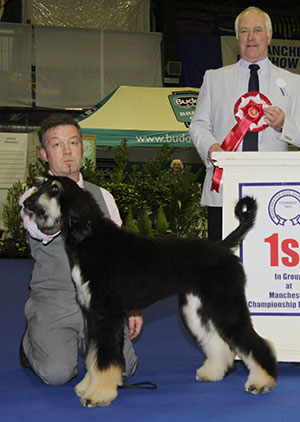 Mr P M Allen & Ms N D Medlam Davashey Flora Burn Of Sazau NAF with puppy group judge Mr P Freer 