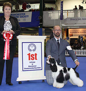 Mr J Lynn & Mr R Da Silva Afterglow Miami Ink with puppy group judge Mrs J Peak 
