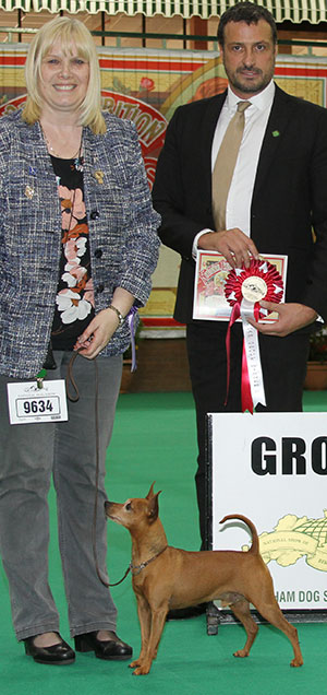Mr T J & Mrs J P Shepherd Ch Shetopa King Of Arabia JW Sh CM with veteran group judge Mr M Cocozza 