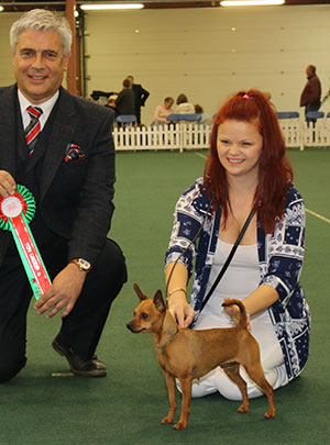 Miss R Stracey Ch Krieger's Bubble Butt JW with group judge Dr T Jakkel