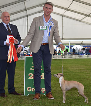 Mrs K Rutter & Mr R Wheeler Ch Chrisford Golden Showers with group judge Mr D Guy